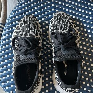 Adidas Swift Run.

Adidas Black and White Sneakers Modern Sporty Design